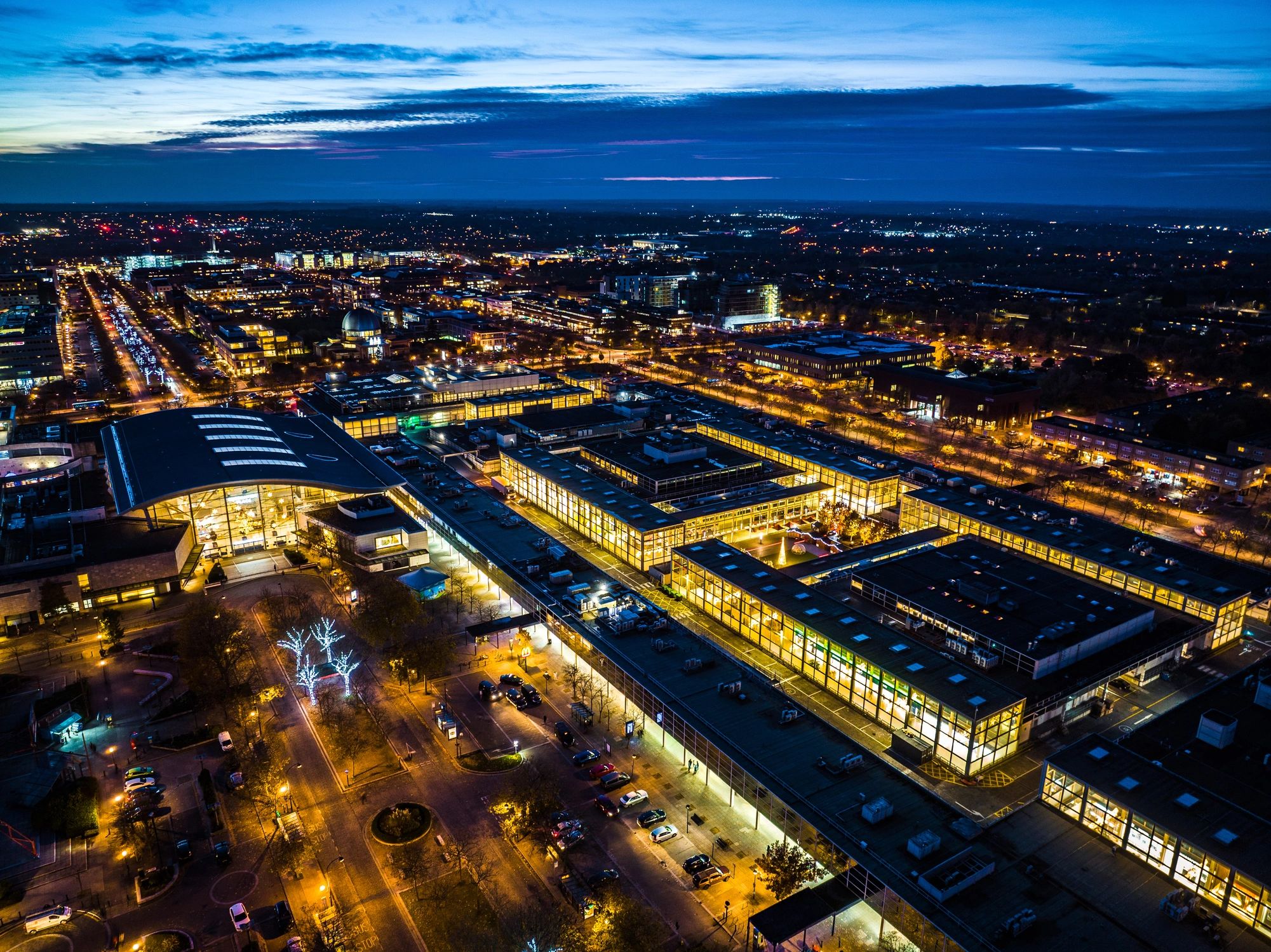 City buildings at night representing exterior lighting design context